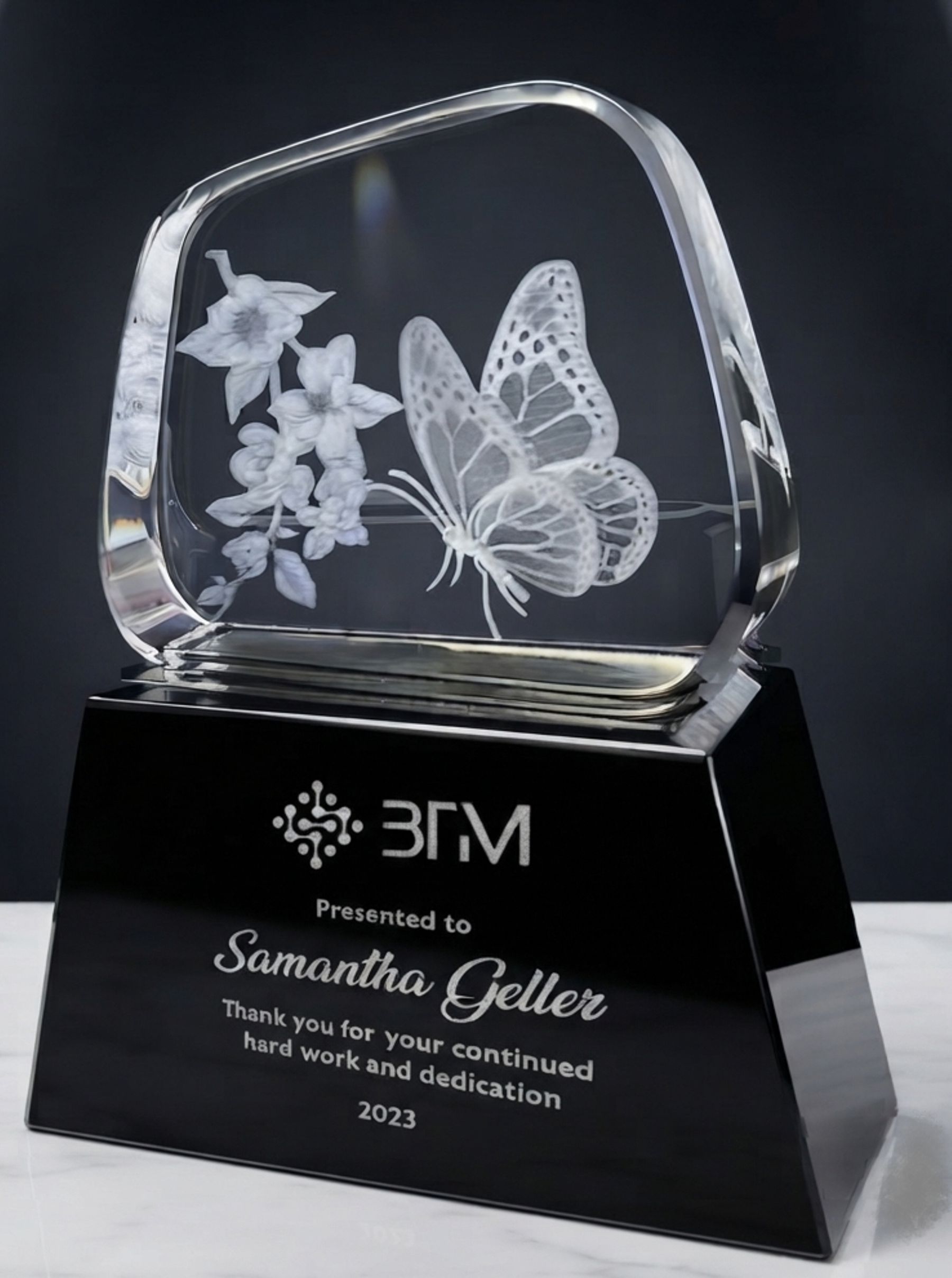Butterfly engraved in clear crystal on black base
