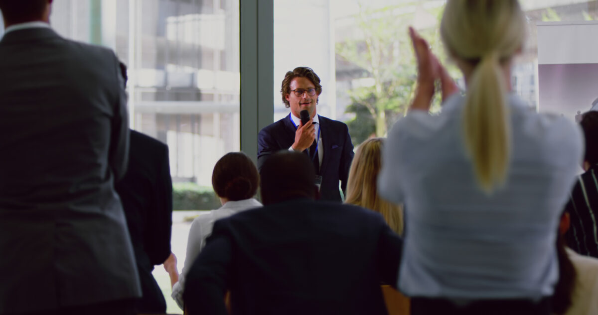 A man hosting an award ceremony