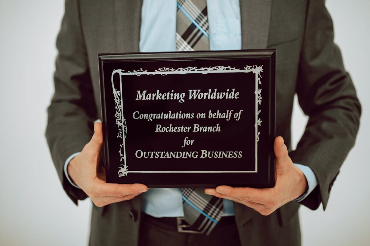 A man received an award for doing a good job in marketing